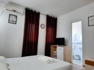A bed or beds in a room at Apartments Alavana