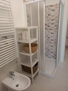 a white bathroom with a toilet and a sink at A casa dalla Lu in Chiavari +11 photos