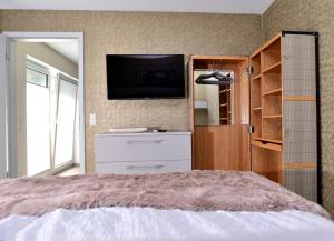Postel nebo postele na pokoji v ubytování Aparthotel-Stadtallendorf