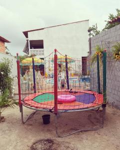 a merry go round in a playground at Pousada Aconchego Santarém in Barreirinhas