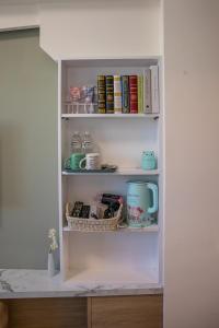 a cupboard filled with lots of books at 看見花蓮民宿See Hualien Homestay in Hualien City
