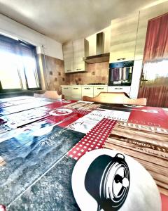 a kitchen with a kitchen floor with a counter top at Pineta sul mare S'Ena e Sa Chitta in Santa Lucia