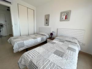 Posteľ alebo postele v izbe v ubytovaní Ático Bahía del Sol en Calpe con impresionantes vistas - Inmodream Calpe