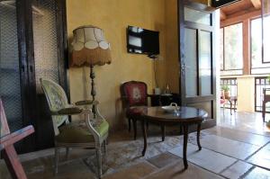 TV a/nebo společenská místnost v ubytování Atelier Luxury Rooms