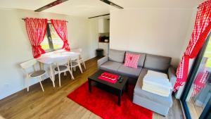 a living room with a couch and a table at Mar&Vi in Batizovce