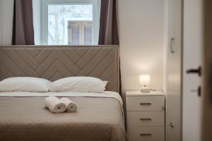 Postel nebo postele na pokoji v ubytování Deluxe Apartment Antonija