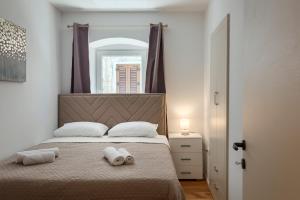 Postel nebo postele na pokoji v ubytování Deluxe Apartment Antonija