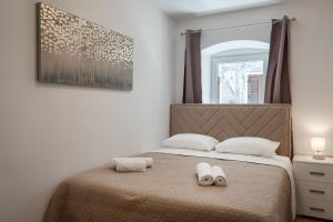 Postel nebo postele na pokoji v ubytování Deluxe Apartment Antonija