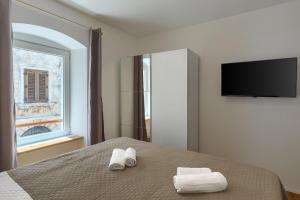TV a/nebo společenská místnost v ubytování Deluxe Apartment Antonija