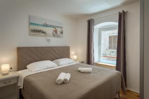 Postel nebo postele na pokoji v ubytování Deluxe Apartment Antonija