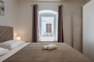 Postel nebo postele na pokoji v ubytování Deluxe Apartment Antonija
