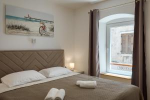 Postel nebo postele na pokoji v ubytování Deluxe Apartment Antonija