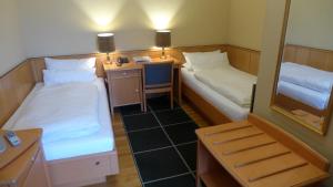 Voodi või voodid majutusasutuse Central-Hotel Greiveldinger toas