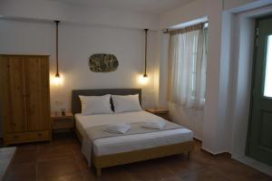 Postel nebo postele na pokoji v ubytování Laskarina Apartments