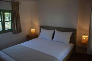 Postel nebo postele na pokoji v ubytování Laskarina Apartments