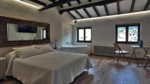 En eller flere senge i et værelse på La Posada de la Xana
