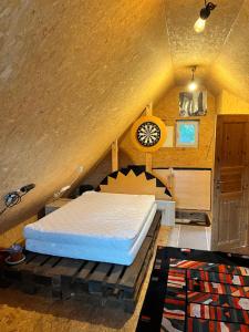 a bedroom with a bed in a attic at Gemütliches Gästehaus mit kleiner Terasse in Schloß Holte-Stukenbrock
