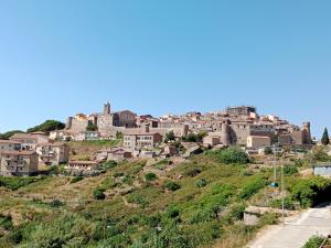 a town on a hill with houses on it at Casa girasole in Isola del Giglio