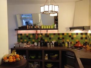 a kitchen with a counter with a bowl of fruit at Riad Aziman in Tétouan