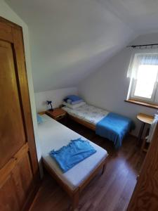 Postel nebo postele na pokoji v ubytování Dom na Mazurach Gąsiorowo