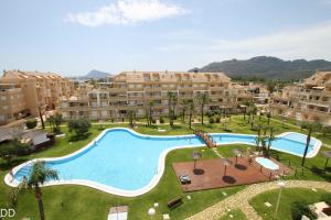 an aerial view of an apartment complex with a large swimming pool at TAMARINDO in Denia