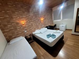 Postel nebo postele na pokoji v ubytování Hotel Serra do Mar