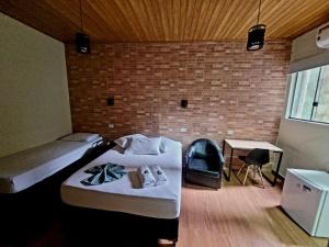 Postel nebo postele na pokoji v ubytování Hotel Serra do Mar