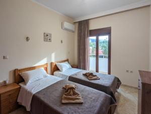 Posteľ alebo postele v izbe v ubytovaní Tharenos home