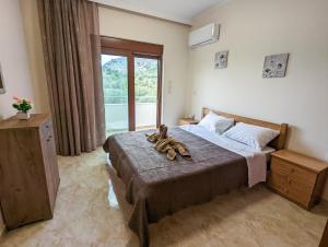 Posteľ alebo postele v izbe v ubytovaní Tharenos home