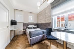 Posteľ alebo postele v izbe v ubytovaní H Aparthotel