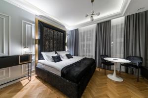 Posteľ alebo postele v izbe v ubytovaní H Aparthotel