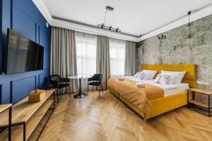 Posteľ alebo postele v izbe v ubytovaní H Aparthotel