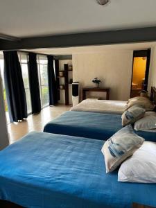 מיטה או מיטות בחדר ב-Casa en Residencial San Gaspar