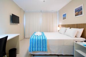 Postel nebo postele na pokoji v ubytování Acqua Inn Maceió Ponta Verde