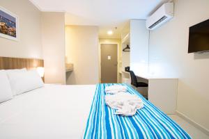 Postel nebo postele na pokoji v ubytování Acqua Inn Maceió Ponta Verde