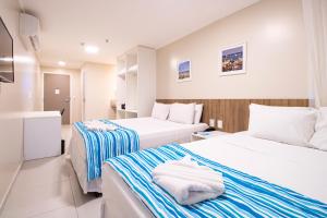 Postel nebo postele na pokoji v ubytování Acqua Inn Maceió Ponta Verde