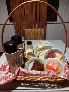 a basket filled with food on top of a table at Chalé Miragem dos Canyons in Praia Grande