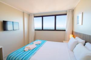 Postel nebo postele na pokoji v ubytování Acqua Inn Maceió Ponta Verde