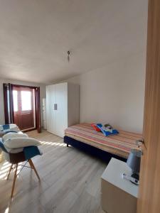 Postel nebo postele na pokoji v ubytování Attico Panoramico Baunei