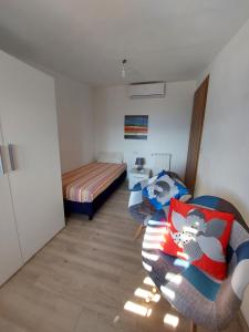 Postel nebo postele na pokoji v ubytování Attico Panoramico Baunei