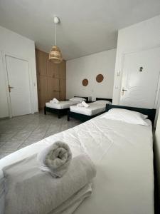 מיטה או מיטות בחדר ב-Eviamar