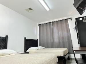 Voodi või voodid majutusasutuse Genesis Suites / Lofts toas