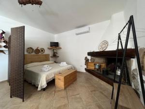 a bedroom with a bed and a piano at RusticHome in Torpè