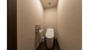 a bathroom with a white toilet in a room at Iroha Grand Hotel Kintetsu Nara Ekimae in Nara