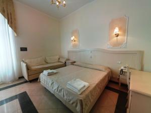 Postel nebo postele na pokoji v ubytování Cambridge Hotel + 37 fotografií