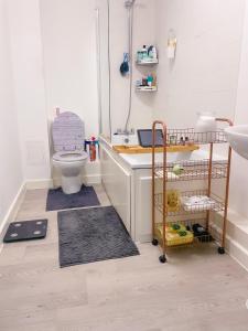 a bathroom with a toilet and a sink at Cosy 1-bedroom apartment in Greater London in London