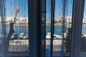 a view through a window of a boat in the water at Sobe Pegla in Zadar