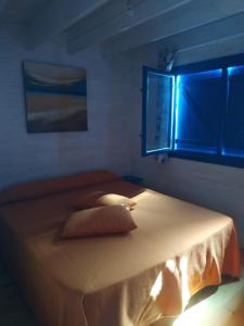Cama ou camas em um quarto em Casita del Volcan