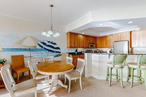 a kitchen and dining room with a table and chairs at Belmont Towers 505 in Ocean City