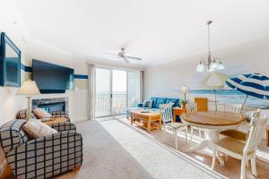 a living room with a couch and a table at Belmont Towers 505 in Ocean City